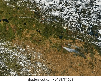 Fires in Alberta and Saskatchewan, Canada. . Elements of this image furnished by NASA.