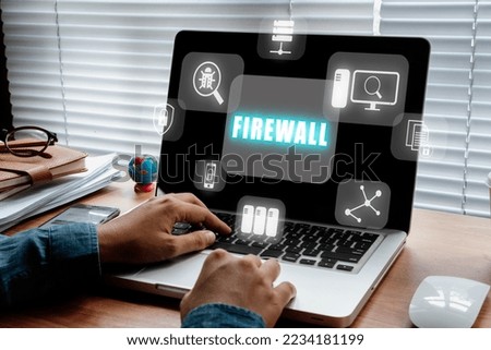 Firewall computing security concept, Person using laptop computer with Firewall icon on virtual screen, Business, Technology, Internet and network.