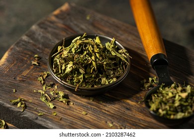 Fireweed or Ivan Chai, dried leaves, close-up. Healthy herbal fermented tea, natural antioxidant on rustic wooden textured table, dark mood photo with copy space. Organic herbal green tea.