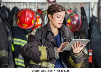 Firewoman Using Digital Tablet At Fire Station - Powered by Shutterstock