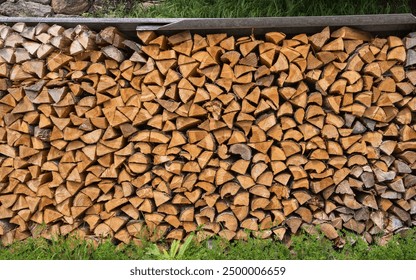 Firewood background. Firewood stack. Stacked split logs. Woodpile. Firewood for winter. - Powered by Shutterstock