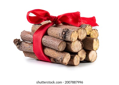 firewood logging. pile of firewood isolated. timber storage of prepared firewood, a bunch of logs, hardwood; Sawed firewood in forest logs close up with red ribbon full depth