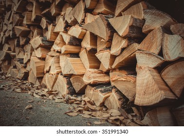 a lot of firewood outdoor, brown background