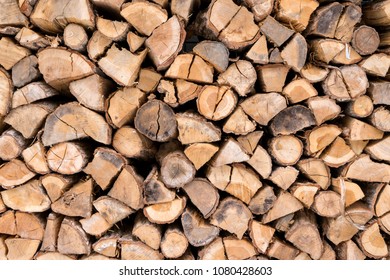 Firewood stacked up in a pile for kindle. - Shutterstock ID 1080428603