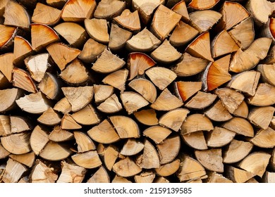 firewood stacked in the woodpile, textured firewood background of chopped wood