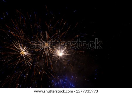 a firework in front of black background