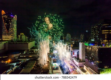 Firework New Years Celebration BANGKOK, THAILAND - DECEMBER 31, 2017: Firework Display Start to 2018 over Central World a Cityscape of the center area around Ratchadamri road in Bangkok, Thailand