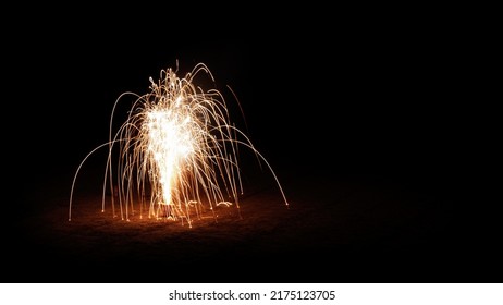 Firework Sparkles In An Orange And Red Color Pallet. The Sparkles Were Shot With A Long Exposure Over Multiple Seconds.
