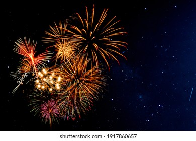 Fireworks with blur milky way background - Shutterstock ID 1917860657