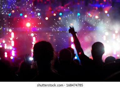 Fireworks and crowd celebrating the New year  - Shutterstock ID 168474785