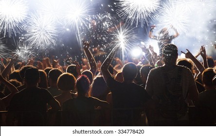 Fireworks and crowd celebrating the New year - Shutterstock ID 334778420