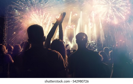Fireworks and crowd celebrating the New year - Shutterstock ID 542980726