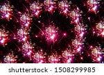 Fireworks explode into a symmetrical radial pattern. Captured in camera through a multi-image prism filter during a evening celebration.