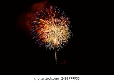 Fireworks Exploding Over the Mountains at night. Vail, Colorado