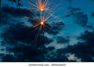 Fireworks Exploding In A Sunset Sky On The 4th Of July