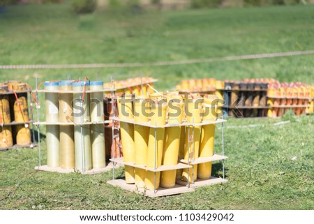fireworks mortar tubes set up in field