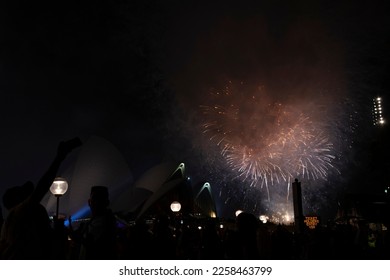 fireworks in the new year in Sydney with people enjoying the celebration