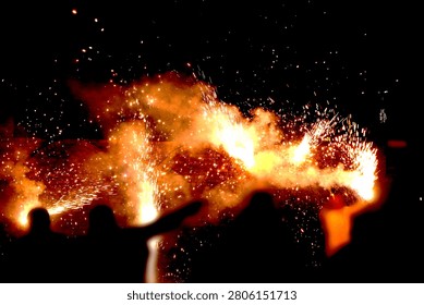 Fireworks Night Scene – Dramatic Pyrotechnic Sparks with Silhouetted Figures Watching Fiery Display Concept