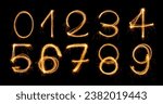 Fireworks numbers 0-9 Burning sparkler Numbers isolated on black background. Sparkler firework light alphabet number zero to nine. Numbers Alphabet of Sparklers to overlay on texture for happy design