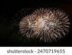 Fireworks on the dark sky background. Colorful fireworks from Loto Quebec in Quebec, Canada. Abstract colored firework background with free space for text. fireworks light up the night sky