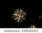 Fireworks on the dark sky background. Colorful fireworks from Loto Quebec in Quebec, Canada. Abstract colored firework background with free space for text. fireworks light up the night sky