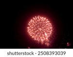 Fireworks on the dark sky background. Colorful fireworks from Loto Quebec in Quebec city, Canada. Abstract colored firework background with free space for text. fireworks light up the night sky