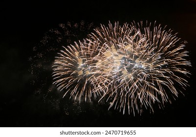 Fireworks on the dark sky background. Colorful fireworks from Loto Quebec in Quebec, Canada. Abstract colored firework background with free space for text. fireworks light up the night sky