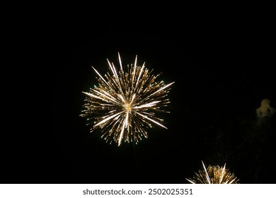 Fireworks on the dark sky background. Colorful fireworks from Loto Quebec in Quebec, Canada. Abstract colored firework background with free space for text. fireworks light up the night sky