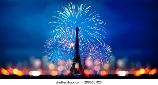 Fireworks Over Eifel Tower In Paris, France With Blurred Night Skyline