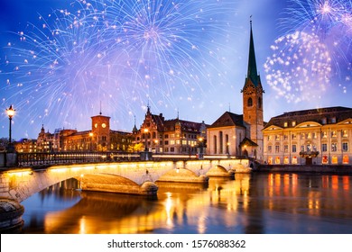 fireworks over Zurich city center with famous Fraumunster and Grossmunster Churches and river Limmat at Lake Zurich, Canton of Zurich, Switzerland