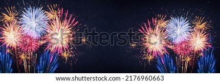 Fireworks pyrotechnics celebration party event festival holiday or New Year background panorama - Colorful firework on dark night sky..