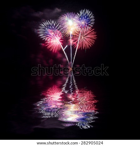 Fireworks reflect water  for festival