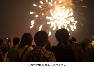 Fireworks with silhouettes of people in a holiday events,Shanghai