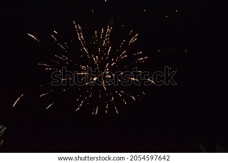  fireworks, splashes of light in the black night sky, holiday. High quality photo