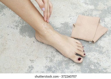 first aid accident ankle with liniment - Shutterstock ID 372260707