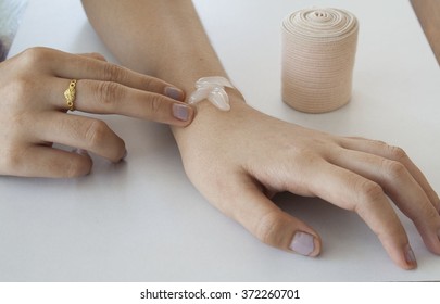 first aid accident wrist with liniment - Shutterstock ID 372260701