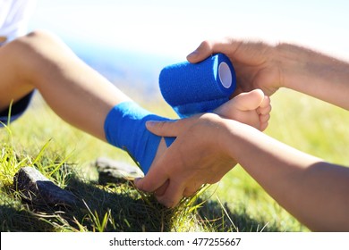 First Aid. The Child Twisted His Ankle During A Mountain Tour. Wound Broken Leg.