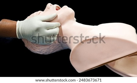 First aid CPR training clear airway with jaw thrust technique.