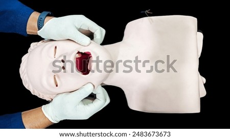 First aid CPR training clear airway with jaw thrust technique.