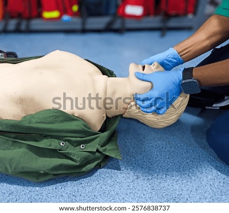 First aid CPR training clear airway with jaw thrust technique.