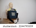first aid defibrillator training manikin. CPR chest compression and automatic external defibrillator (AED) training manikin for people with heart failure and inability - first aid concept.