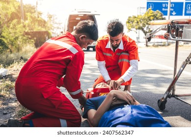 First Aid, Emergency Rescue Team Helping Patient in Emergency Situation. Critical Medical Assistance and Rescue Services in Action | Emergency Response Team. - Powered by Shutterstock