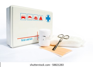 First Aid Kit With Bandages And Scissors On White Background