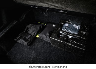 First Aid Kit And Car Kit Emergency Tools In Trunk Of Luxury Car.