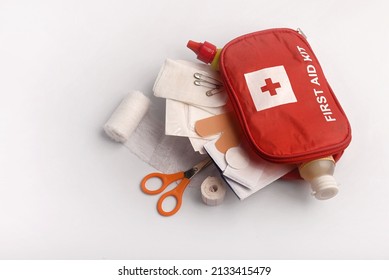 First Aid Kit And Its Contents On A White Background