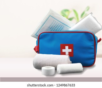 First Aid Kit With Medical Supplies On