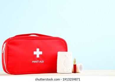 First Aid Kit With Medical Supplies On Mint Background