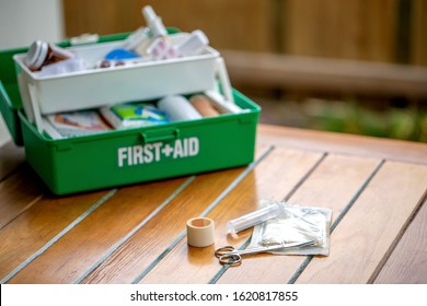 First Aid Kit On The Table In The Garden, Green Box