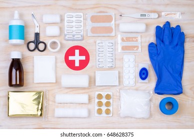 First Aid Kit On White, Wooden Background, Top View