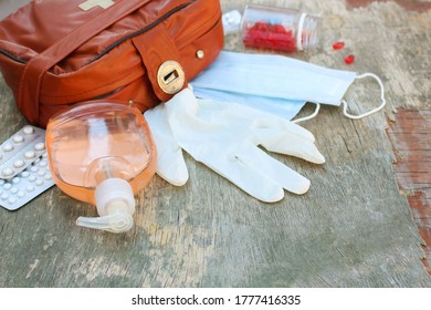 First Aid Kit On Wooden Background. Concept Of Protect Yourself From COVID-2019. 